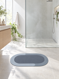 Non-slip bath mat in front of a walk-in shower