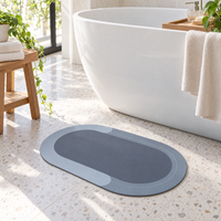 Bath mat in front of a freestanding bathtub